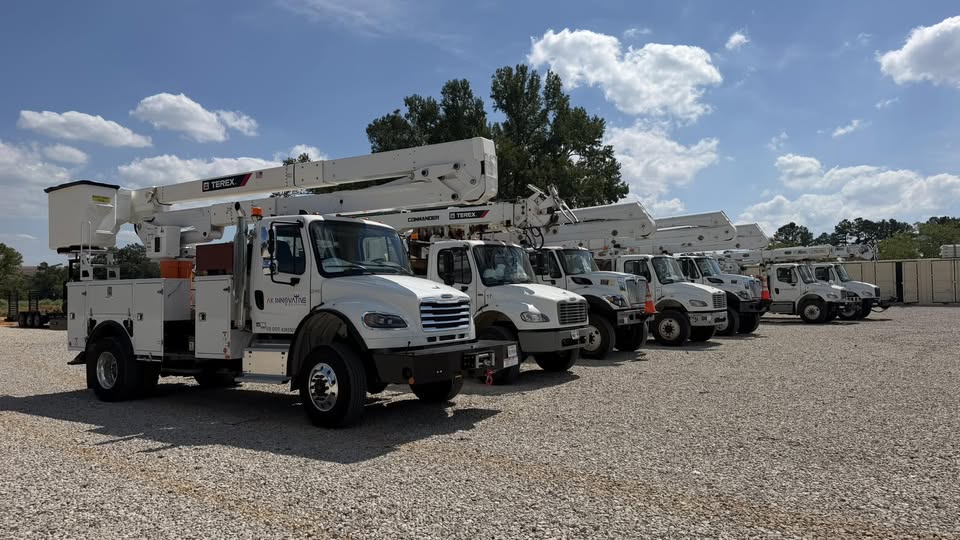 AK Innovative Systems utility truck fleet lined up at the yard